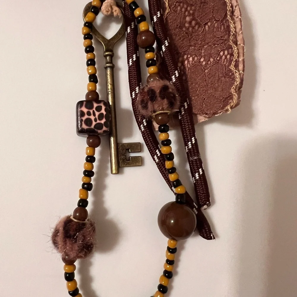 Chic Brown Bow Hair Accessory with Bead Details
